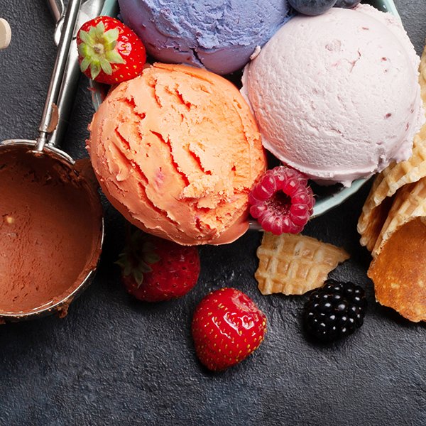 Berry, vanilla and chocolate ice cream scoops. Top view flat lay