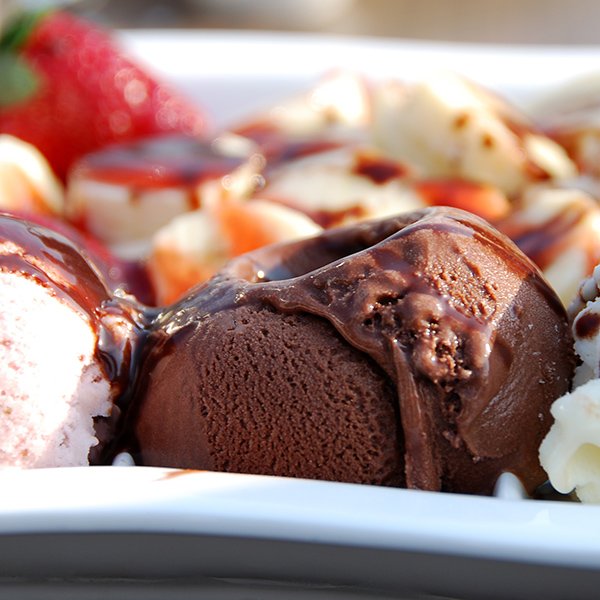 Viriety of ice cream ball with fruits on a plate