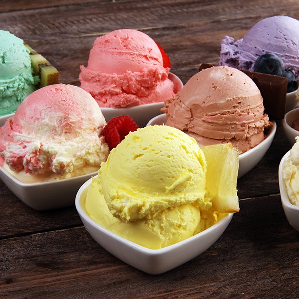 Various of ice cream flavor with fresh blueberry, strawberry, kiwi, lemon, vanilla setup on rustic background . Summer and Sweet ice cream